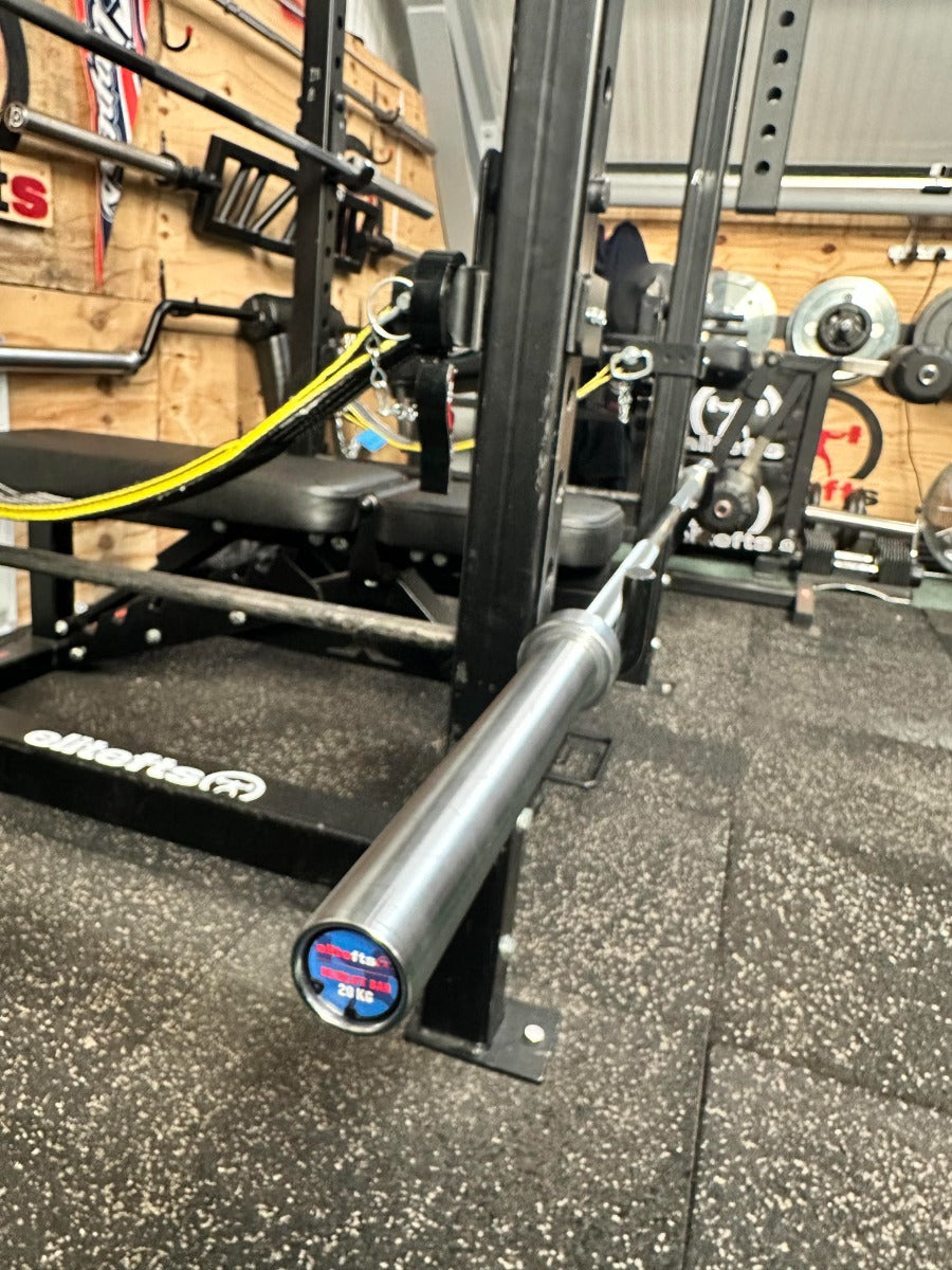 Barbell on a weight rack in a gym setting