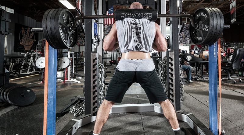Person lifting weights in a gym setting