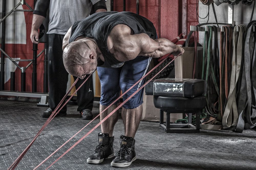 Person using resistance bands in a gym setting